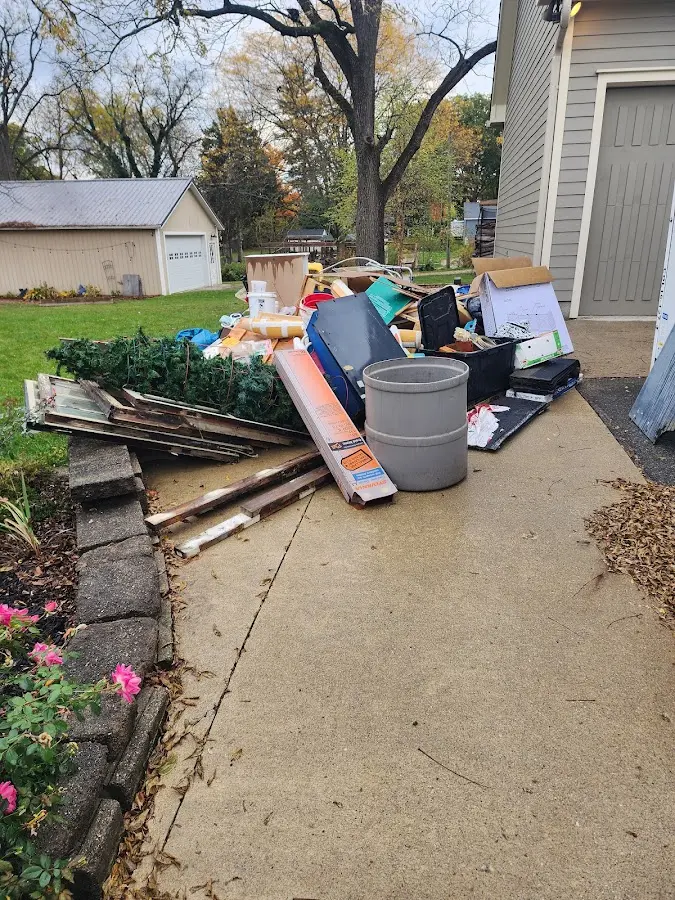 Dumpster being loaded with debris for Roofing Dumpster Rental in Skippack
